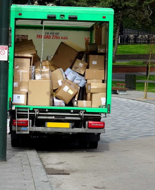 delivery-truck-full-of-parcels Back of truck filled with packages